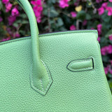 Side view of sculpted structured handbag