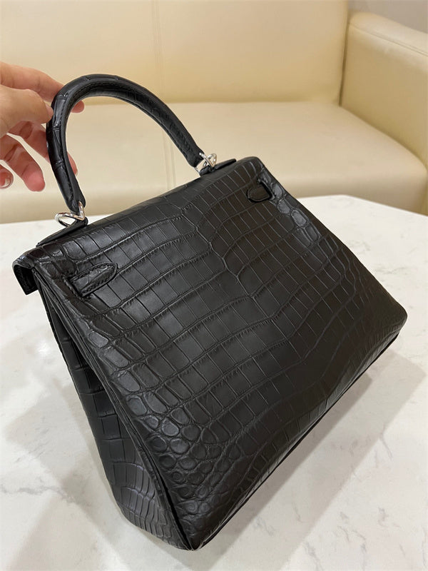 Side view of streamlined structured handbag