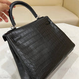 Side view of streamlined structured handbag