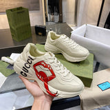 Side profile of Gucci crisp white sneakers retro runner design