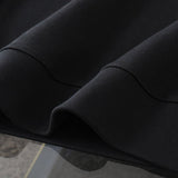 Side profile of Louis Vuitton luxury clothing with tailored silhouette