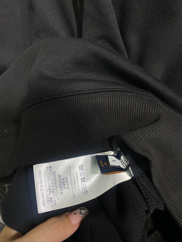 Close-up detail shot of Louis Vuitton luxury clothing with runway-inspired design