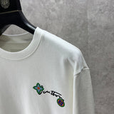 Full styled look of Louis Vuitton luxury clothing with logo-detail design