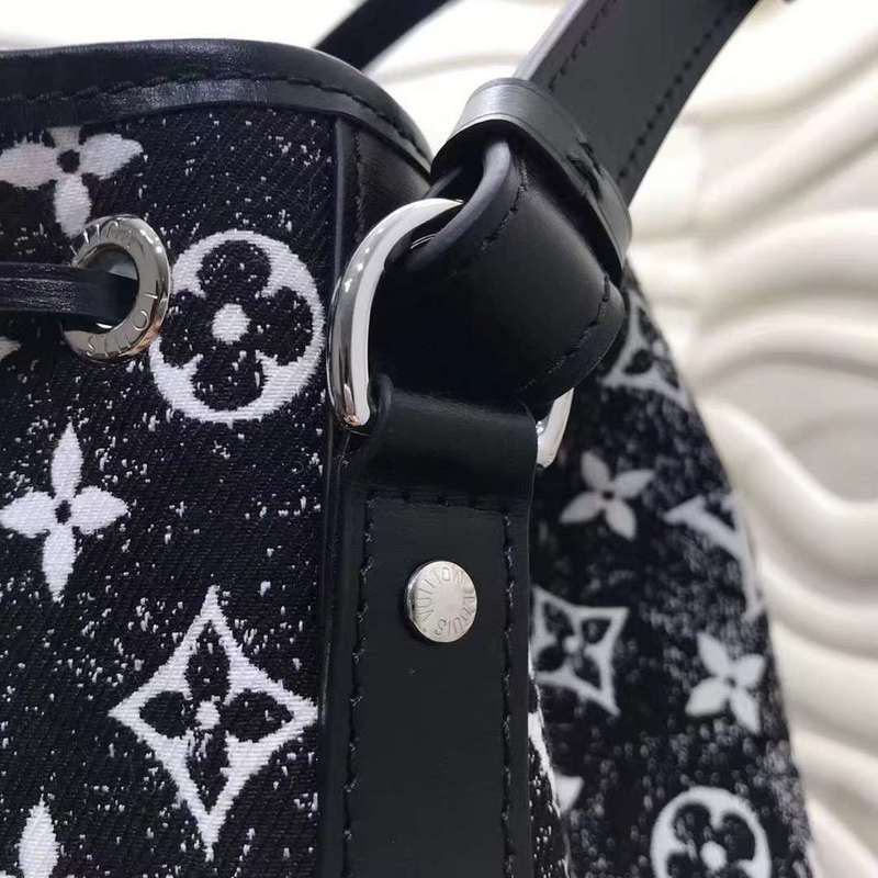 Back view of elevated signature women's handbag – women's statement bag