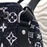 Back view of elevated signature women's handbag – women's statement bag
