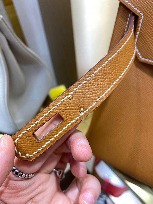 Side view of sleek structured handbag