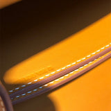 Side view of sculpted structured handbag