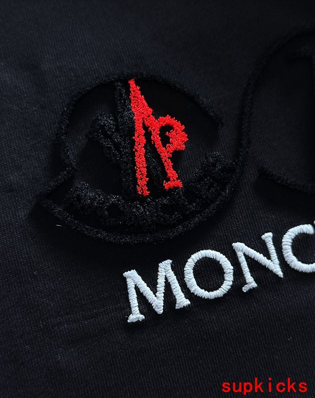 Full styled look of Moncler luxury clothing with signature branding