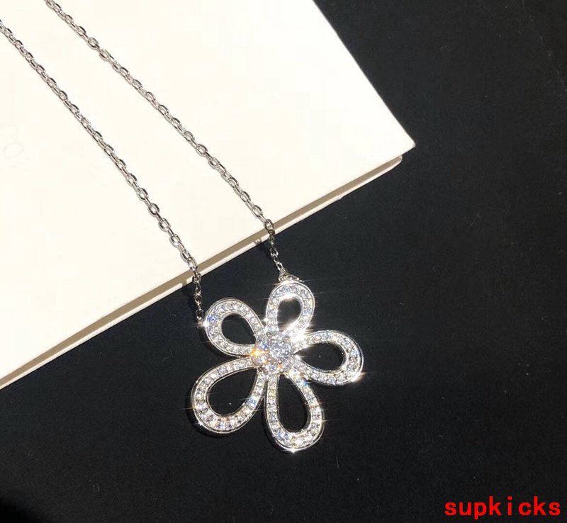Lifestyle view of Van Cleef & Arpels unisex jewelry piece