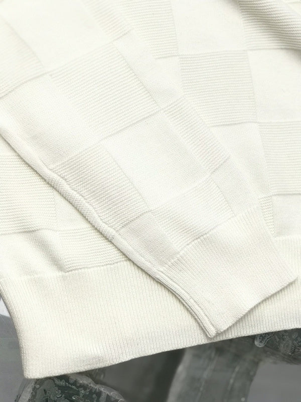 Close-up detail shot of Louis Vuitton luxury clothing with signature branding
