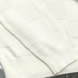 Close-up detail shot of Louis Vuitton luxury clothing with signature branding