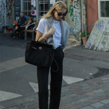 Side view of versatile structured handbag