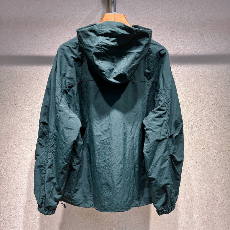Side profile of Louis Vuitton luxury clothing with label-forward styling