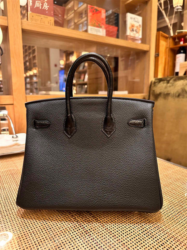  Smart top-handle bag carried on shoulder