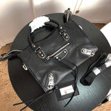 Handle and strap detail of elevated modern women's handbag – women's statement bag