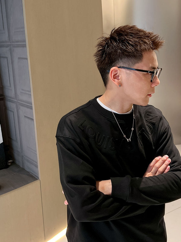 Close-up detail shot of Louis Vuitton luxury clothing with relaxed-fit cut