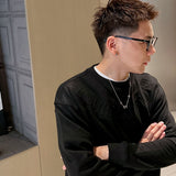 Close-up detail shot of Louis Vuitton luxury clothing with relaxed-fit cut