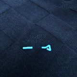 Flat lay presentation of Louis Vuitton luxury clothing with monogram-inspired silhouette