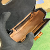 Side view of sleek structured handbag