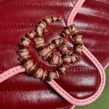 Back view of statement signature women's handbag – women's statement bag