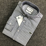 Flat lay presentation of Lacoste luxury clothing with logo-detail design