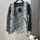 Side profile of Louis Vuitton luxury clothing with label-forward styling