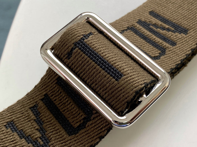 Handle and strap detail of structured polished women's handbag – women's designer-style accessory