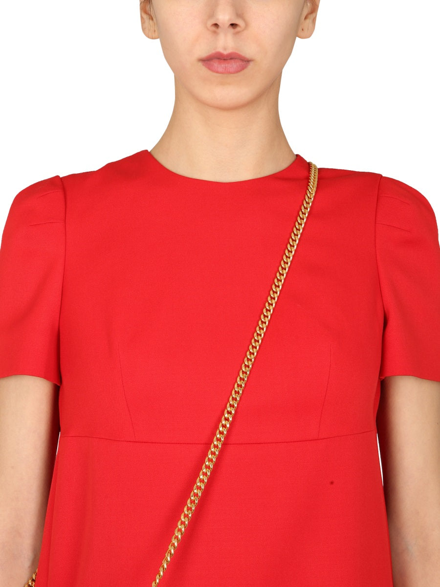Close-up of Alexander McQueen cocktail dresses hardware and fine stitching