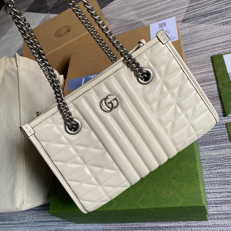 Handle and strap detail of modern polished women's handbag – women's luxury accessory