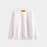 Side profile of Louis Vuitton luxury clothing with label-forward styling