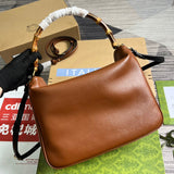 Handle and strap detail of structured everyday-luxe women's handbag – women's luxury accessory