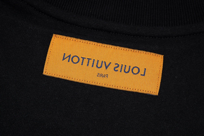 Close-up detail shot of Louis Vuitton luxury clothing with logo-detail design