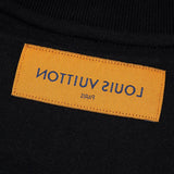 Close-up detail shot of Louis Vuitton luxury clothing with logo-detail design