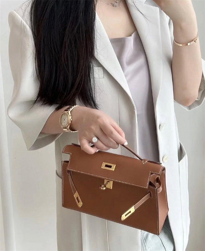  Signature crossbody bag carried on shoulder
