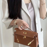  Signature crossbody bag carried on shoulder