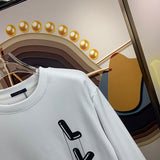 Flat lay presentation of Louis Vuitton luxury clothing with tailored silhouette