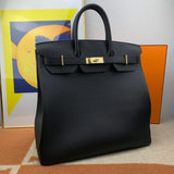 Side view of classic structured handbag