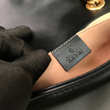 Side profile of structured statement women's handbag – women's luxury accessory