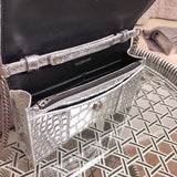 Handle and strap detail of polished everyday-luxe women's handbag – women's designer-style accessory