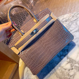 Side view of streamlined structured handbag