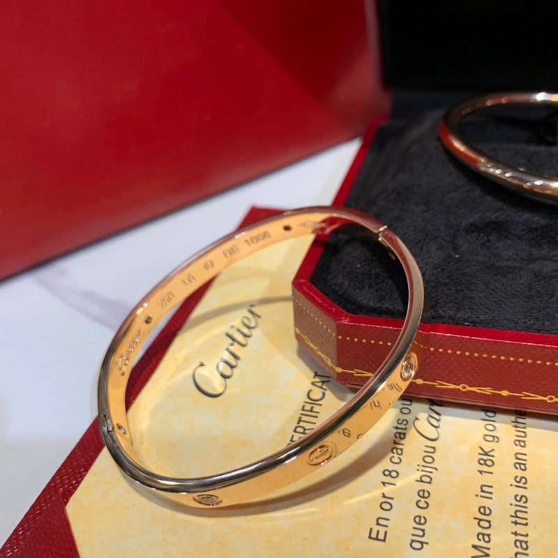 Side view of Cartier unisex jewelry piece