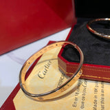 Side view of Cartier unisex jewelry piece