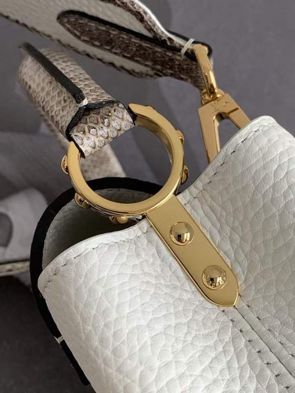 Handle and strap detail of polished chic women's handbag – women's luxury accessory
