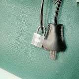 Side view of clean-lined structured handbag