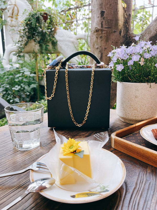 Side view of clean-lined structured handbag