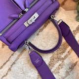 Side view of streamlined structured handbag