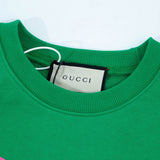 Close-up detail shot of Gucci luxury clothing with relaxed-fit cut
