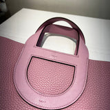  Tailored satchel carried on shoulder