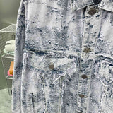 Front view of Louis Vuitton luxury clothing with signature branding