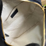Close-up detail of classic sleek women's handbag – women's luxury accessory